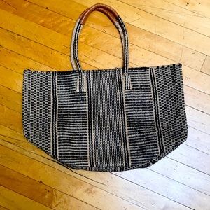 Woven hemp tote with leather wrapped handles